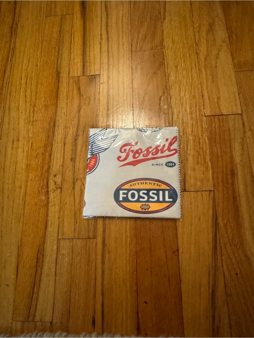 Fossil White Clean Cloth with Retro Logo Graphics to clean sunglasses